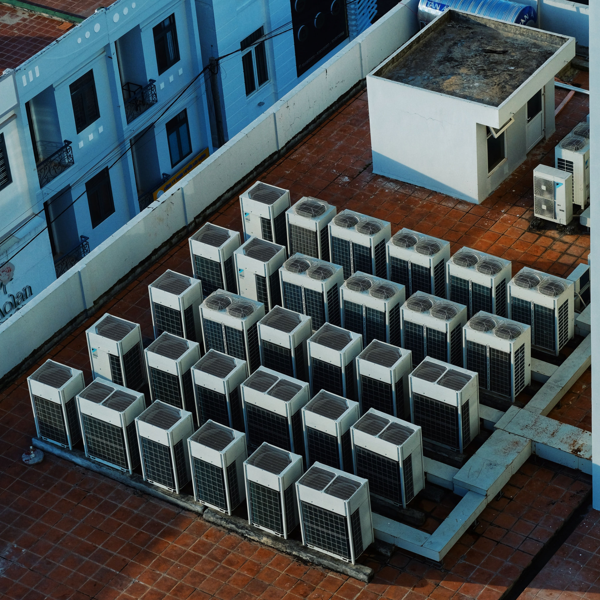 Rows of HVAC rooftop units on a commercial building